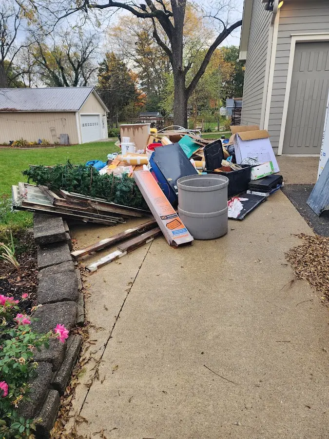 Dumpster being loaded with debris for Commercial Dumpster Rental in Leeds
